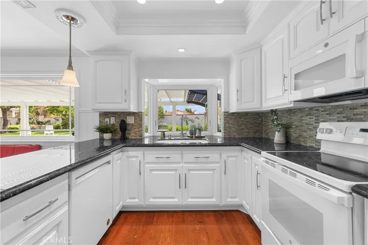  Kitchen looks out to Pool and Backyard