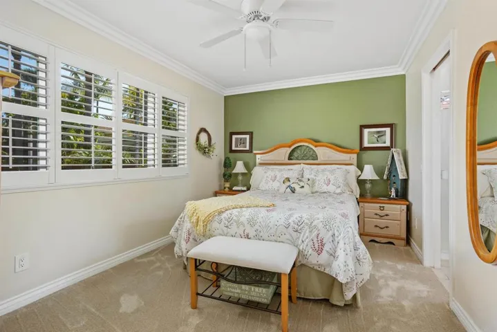 Bedroom with walk-in closet and private, en suite bathroom.