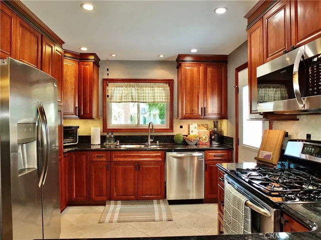 Enjoy preparing meals in your  remodeled cherrywood kitchen