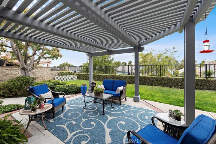 Truly beautiful back garden patio with the cover and featuring the expansive view of t Saddleback and hills.