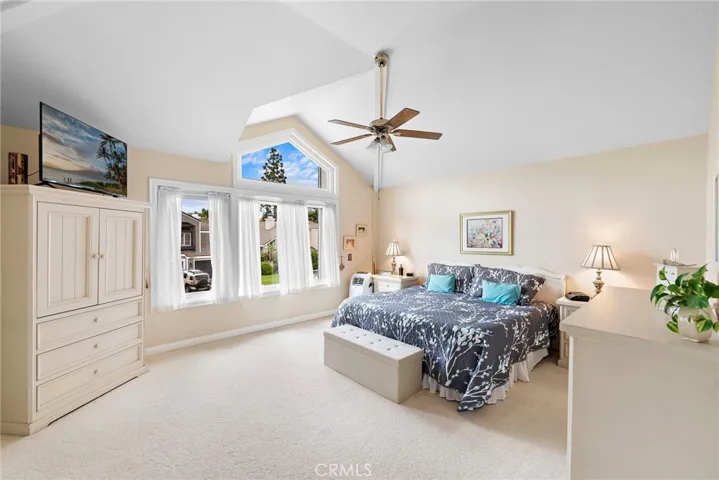 Extremely generous primary suite with a bay of windows to the ceiling and large closets