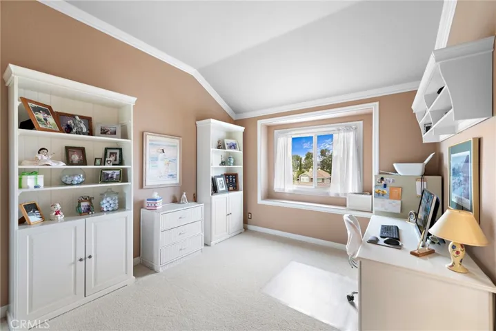 Secondary bedroom with high ceilings and large window adjacent to the jack and jill bathroom.