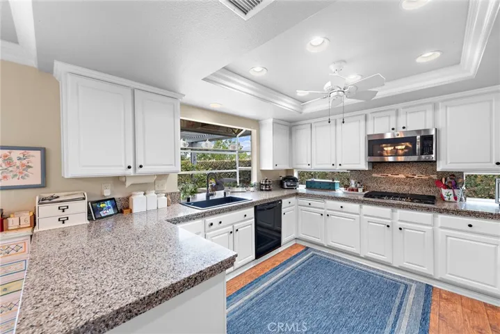 kitchen features with gas stove top, micro wave oven and counter windows for more light!