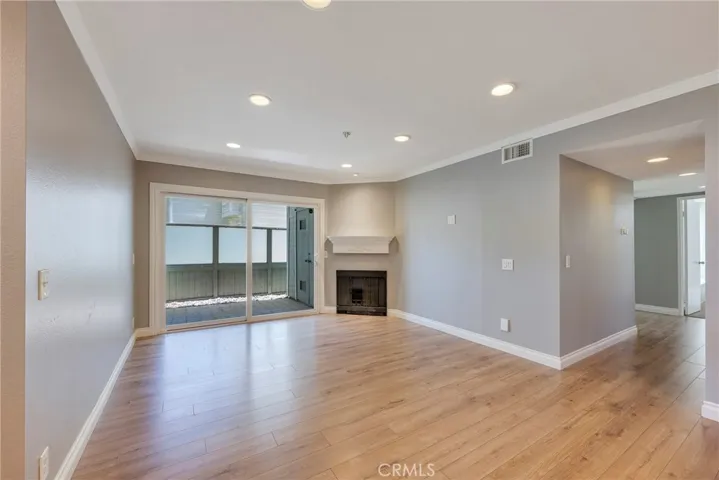 Large Livingroom offers lots of light and a fireplace