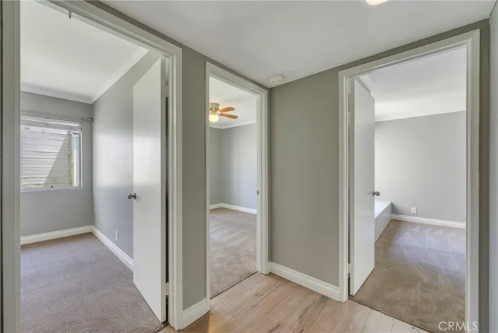 Hallway to three bedrooms