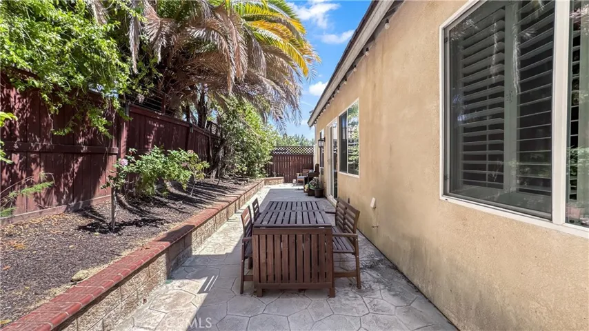 Backyard view is nice with shade  and low maintenance.