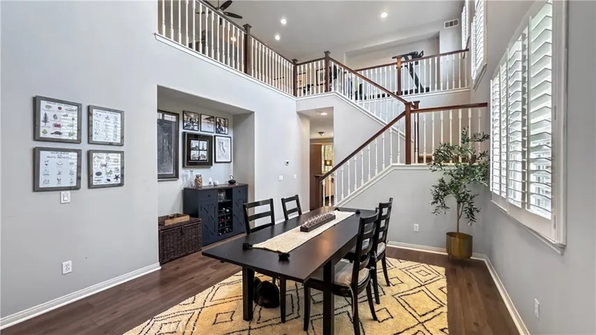 As walk in the front door your currently in the formal dinning area with  an amazing  natural light coming in, recessed lighting, plantation shutters, and beautiful view of staircase leading up to the loft and 3rd bedroom upstairs.