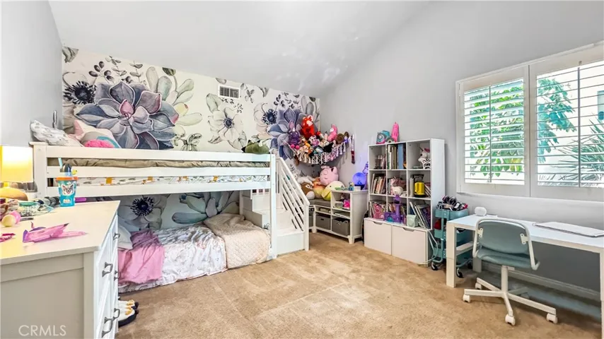 Bedroom #3 is located upstairs had a neat feature sloped ceiling and a nice closet.