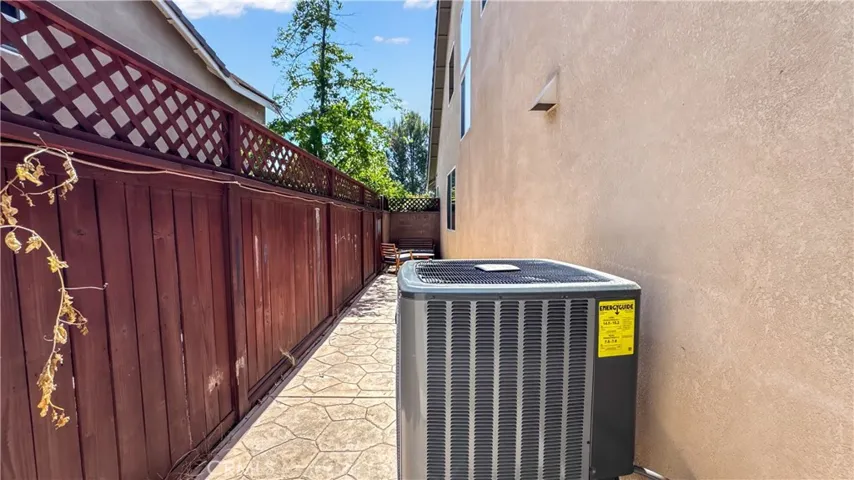 Side view of house with HVAC System " Central Air & Heat"