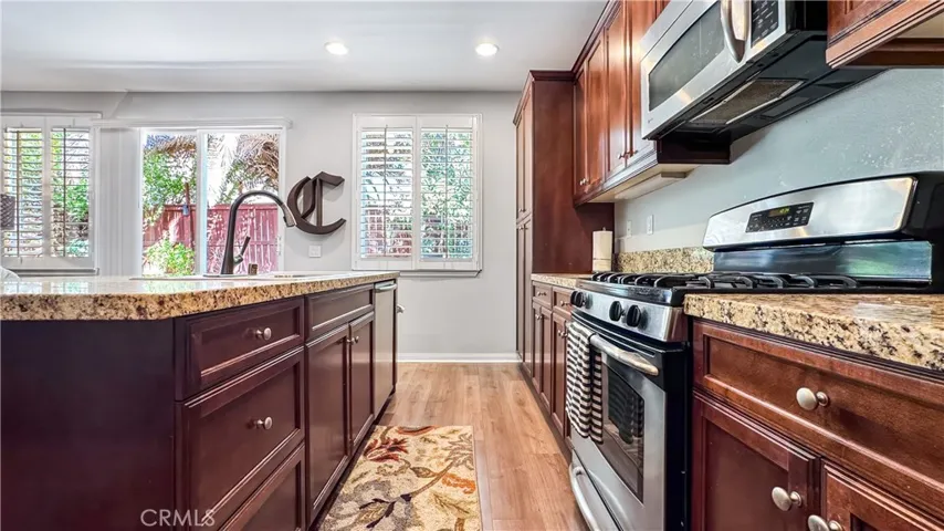 A popular feature in this kitchen is windows bring in nice natural light. A sink in kitchen Island is a great feature of this house allows you to interact with guest and family while preparing food or cleaning.  All appliances are included in sale Stove and Refrigerator.