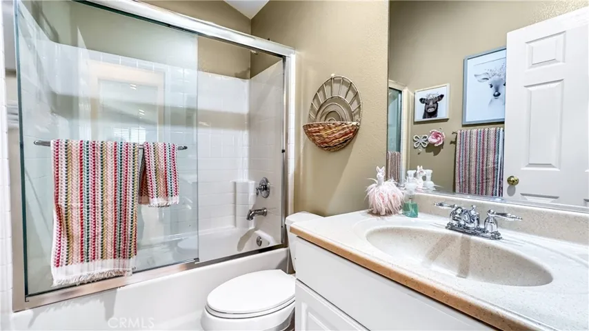 Full Bathroom next to  Bedroom #3 and upstairs loft located upstairs . As you walk outside of bathroom you will find a nice linen cabinet .