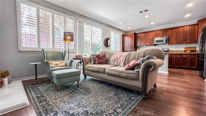The Great open-concept  room is a family room area for everyday living and special gatherings. It has a sliding glass door leading to backyard.