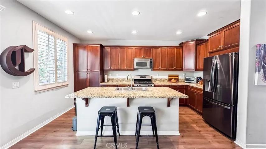 Kitchen Island is focal point for  this kitchen which can serve as a casual dinning area, cooking, baking station and a great place for increased social interaction during meal preparation or entertaining. An added bonus is the refrigerator is included in sale of home.