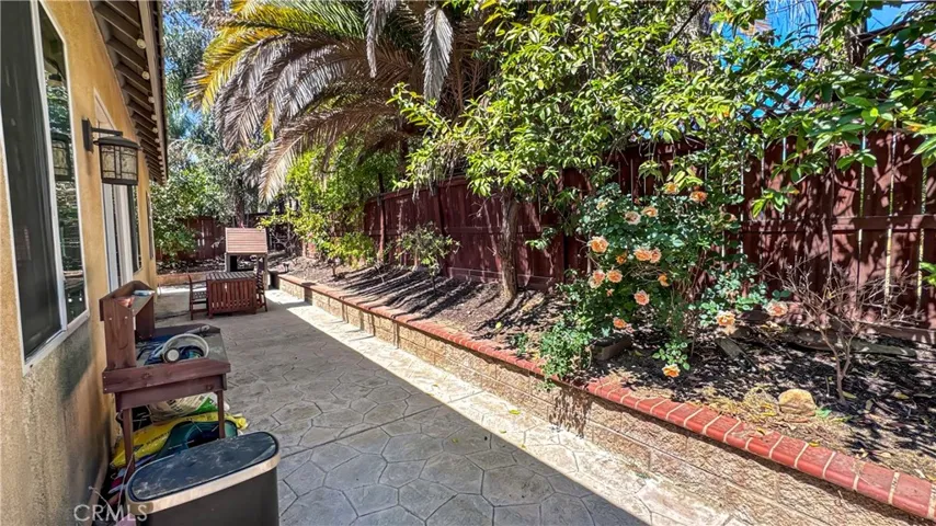 Back yard with planters and nice shade
