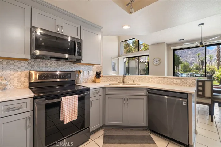 Updated kitchen with all stainless steel appliances.