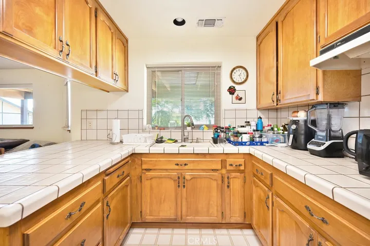 Kitchenette with sink, lots of counter space and fridge