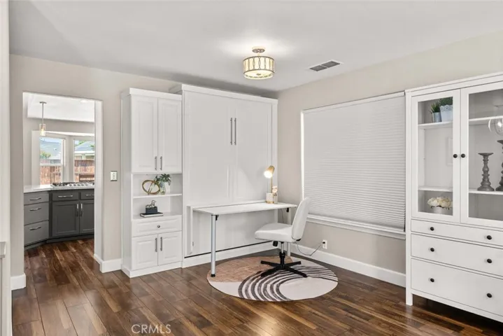 Murphy bed folded up with desk out.