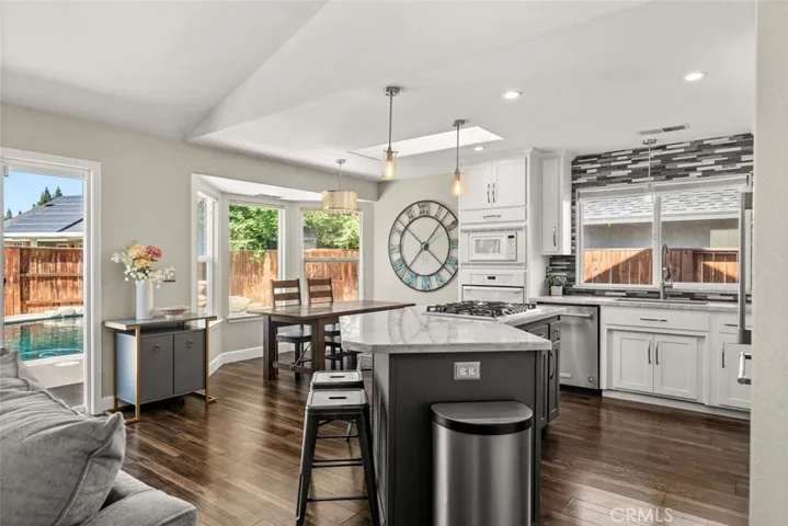 kitchen and dining area looking out to pool.