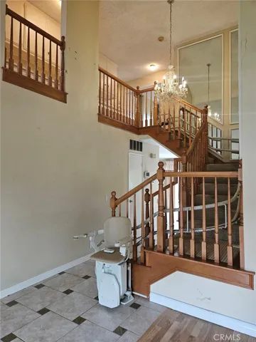 Elegant Spiral Staircase with a High End Chair Lift