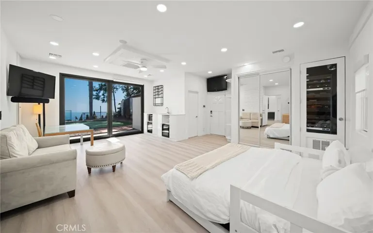 First floor bedroom with wetbar... opens to putting green and views