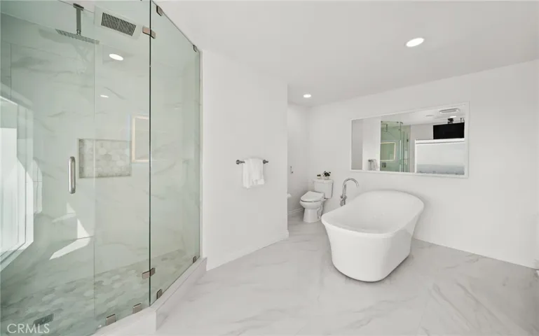 Shower and soaking tub in "hers" Primary Bathroom