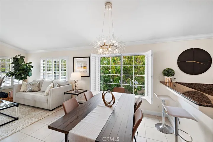 DINING ROOM - SHUTTERS OPEN - MATURE TREES IN BACKYARD