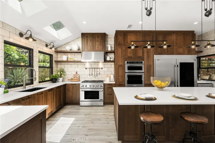 with a full suite of luxury, stainless-steel appliances