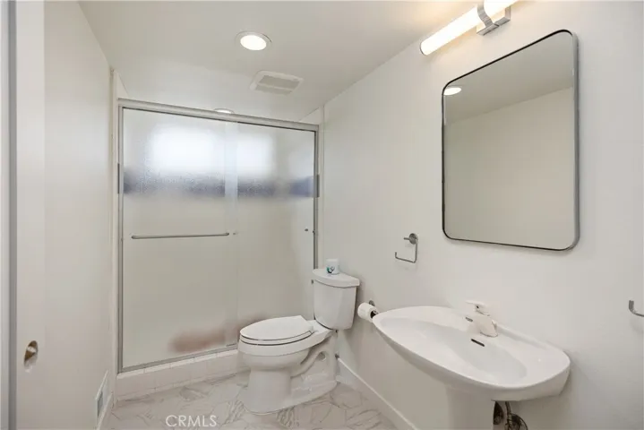 Full bath just off the side entrance from garage
