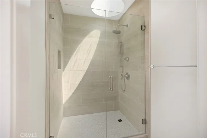 Newly renovated all tile shower with its own skylight