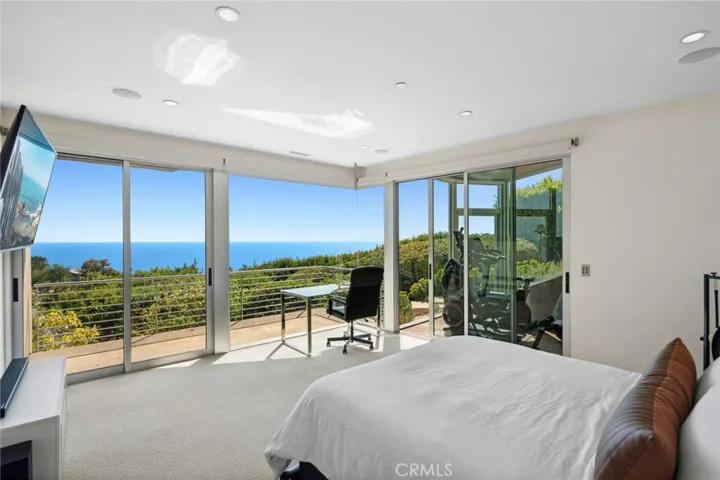 Bedroom on middle level with ocean views and private terrace