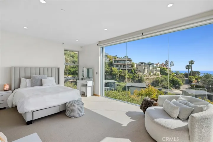 Bedroom on lower level with ocean views and private terrace