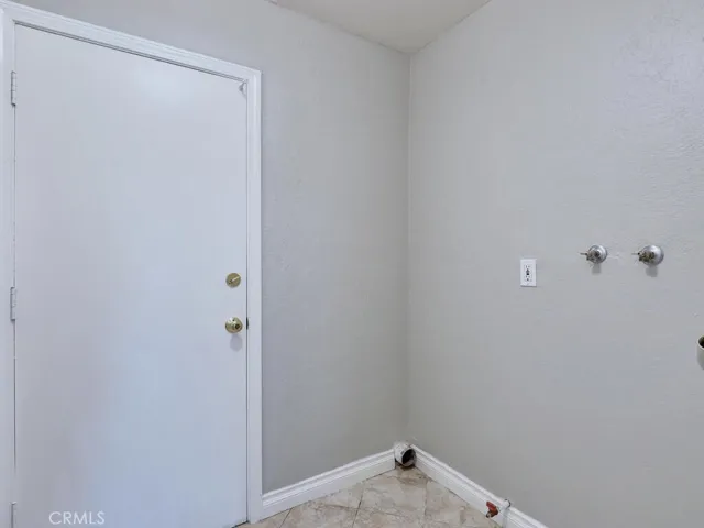 Indoor laundry room with access to 2-car garage