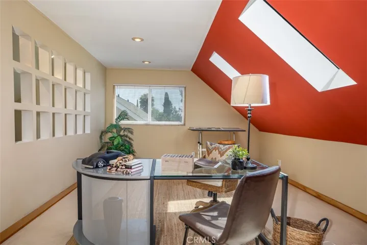 Skylights bring in natural light showcasing the cut outs in the wall.