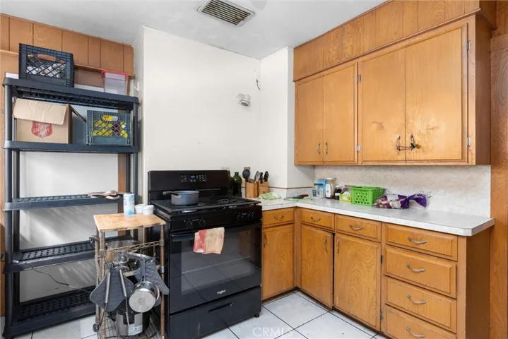 Kitchen with closed off access to formal dining (currently a bedroom)