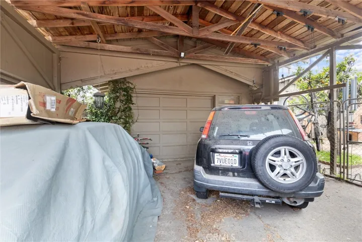 Carport attached to oversized 1 car garage.