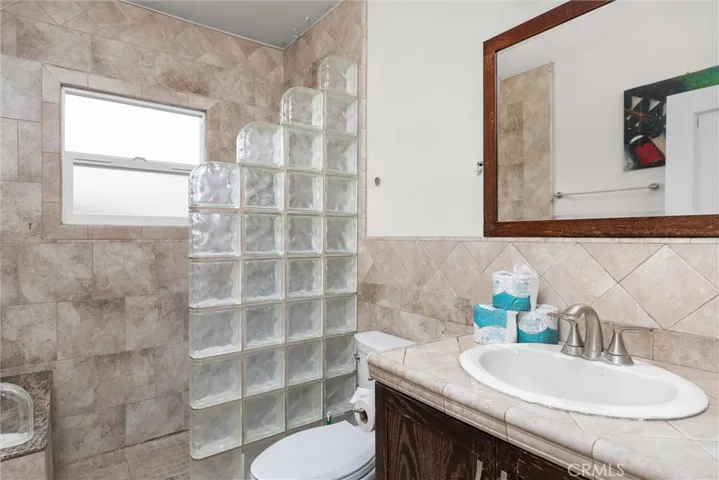 Remodeled second bath with custom tile