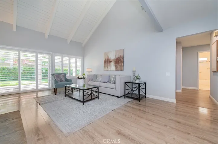 Large open family room with access to the back yard & patio.