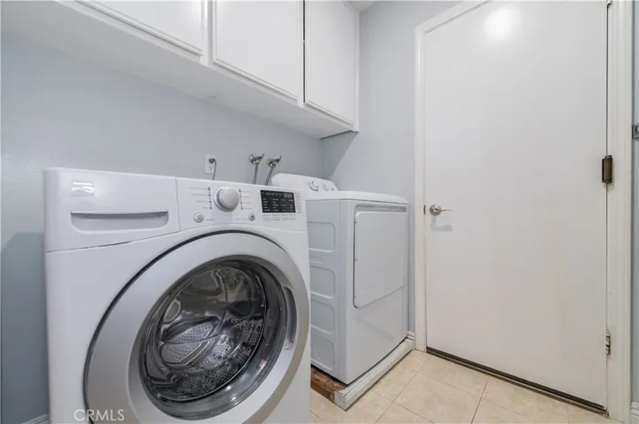 Laundry room with washer, dryer & hand sink