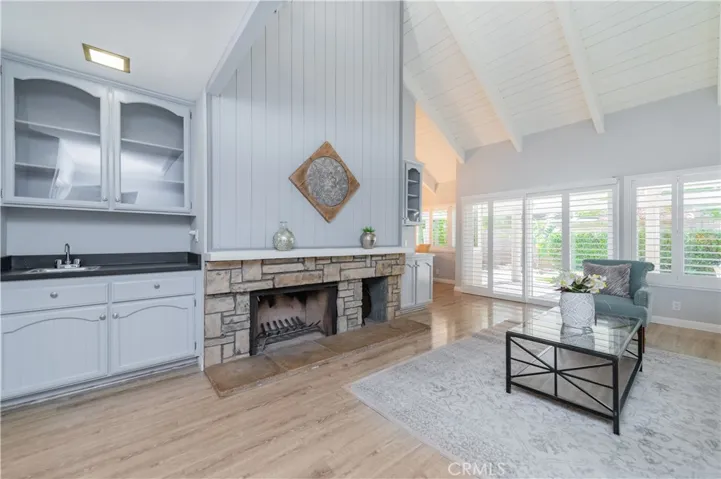 Open floor plan in family room with impressive vaulted ceilings