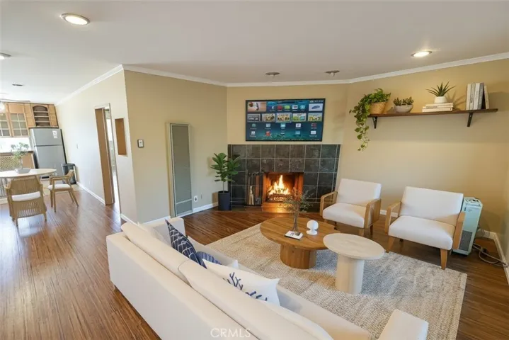 "Virtual STAGED" Livingroom area into dining and kitchen area, wall furnace and gas fireplace.
