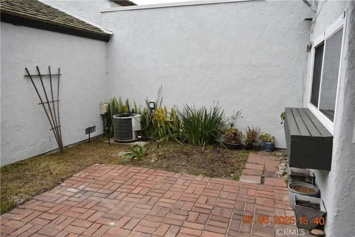 Patio area between garage and unit