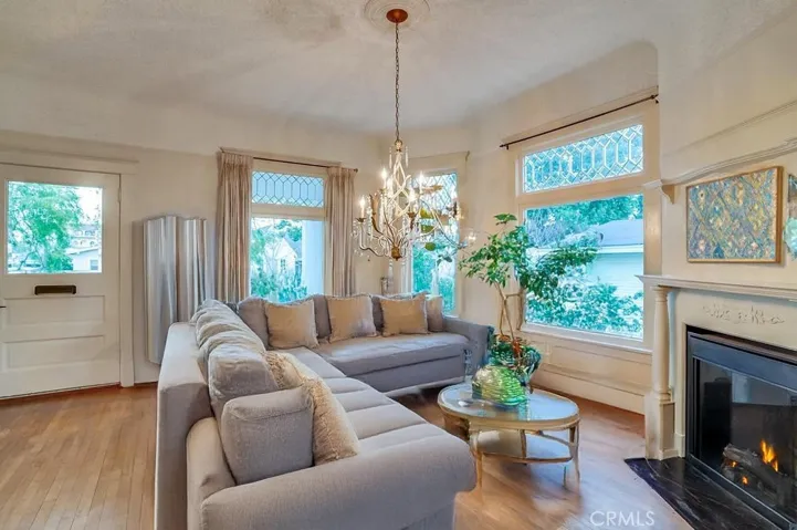 Virtually staged front Parlor/ dining room with fireplace