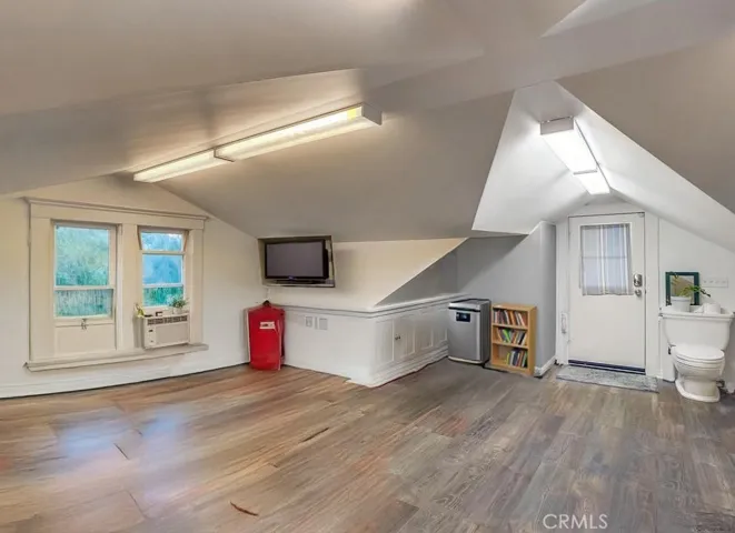 Room Over garage virtually staged looking at entry door