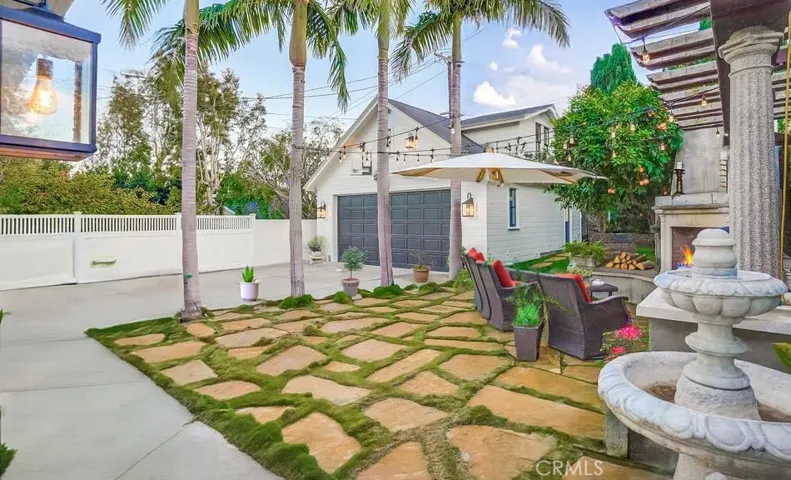 Backyard looking at Garage and extra room above garage