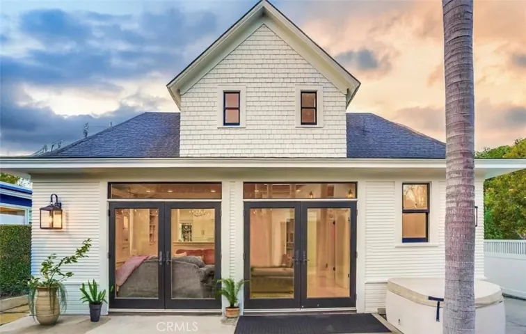 Back of house, two sliders leading to gorgeous backyard