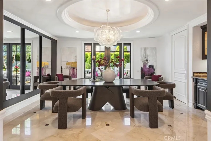 Formal dining room with extended entertaining space on the terrace.