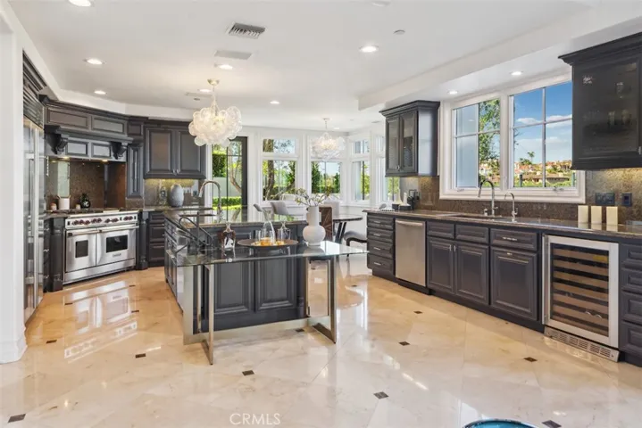 Formal kitchen with Talia lighting, Wolf, Sub Zero, Waterworks.