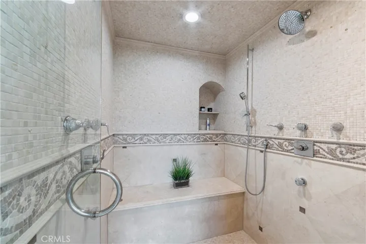 Primary walk-in shower/steam room.