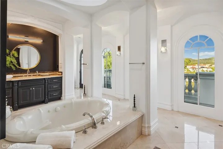 Primary spa relaxing. There a two private sink areas.