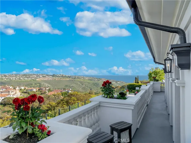 Primary balcony sitting area with ocean views.